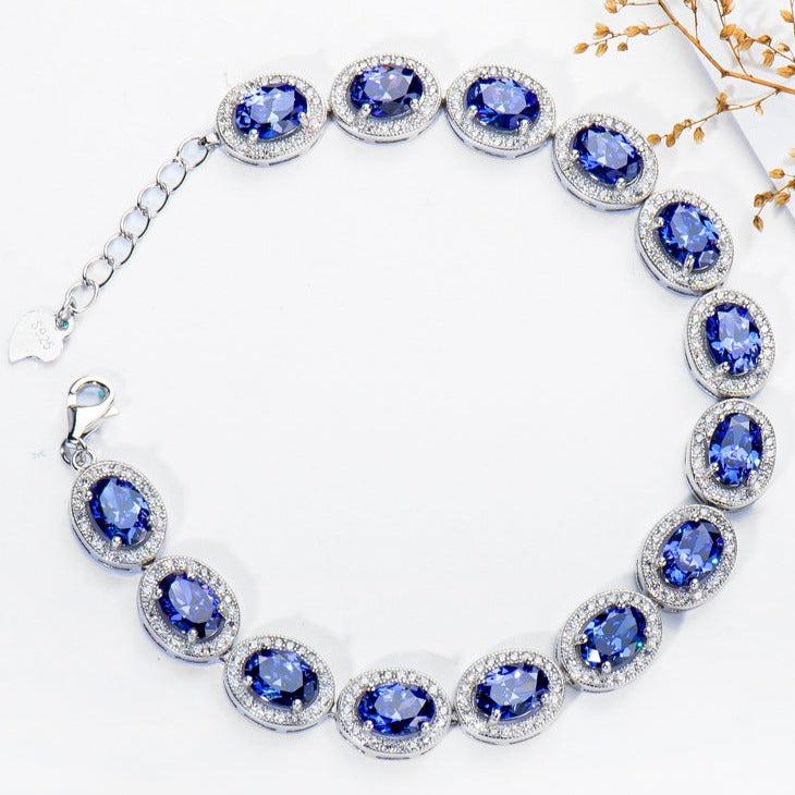 Oval Cut Sapphire Tennis Bracelet in Sterling Silver Shineofdiamond