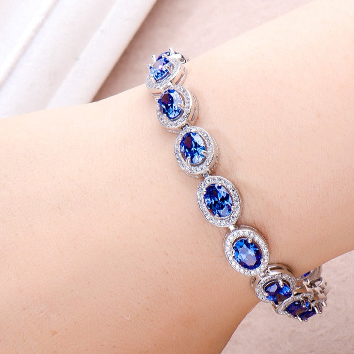 Oval Cut Sapphire Tennis Bracelet in Sterling Silver Shineofdiamond
